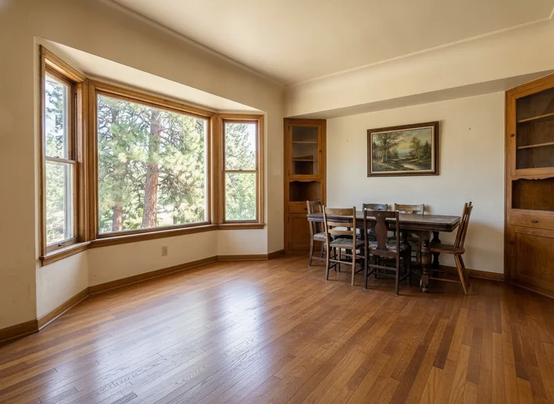 The same dining room oak floor after sanding and an even medium-brown stain