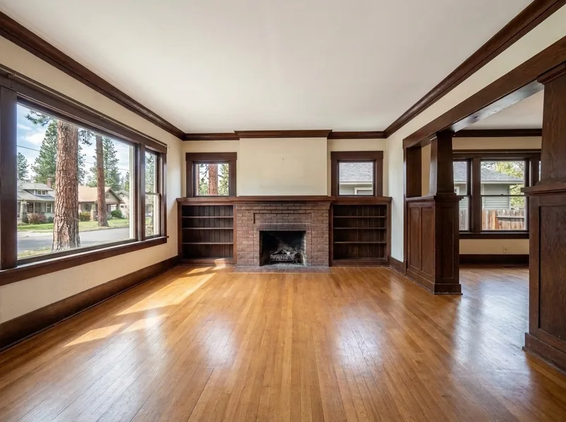 The same Craftsman living room floor after sanding and a warm natural satin finish